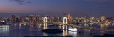 Fototapeta Miasta - Wide panorama image of Tokyo cityscape at dusk with Rainbow bridge and Tokyo tower.