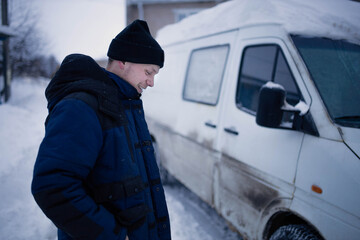 Wall Mural - male delivery van driver in winter.