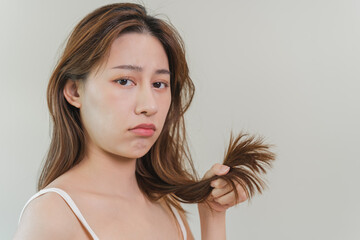  Beautiful young asian woman worry with her messy hair