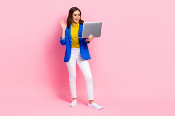 Poster - Full size photo of pretty positive girl arm waving hi video call wireless netbook isolated on pink color background