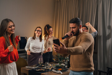 Sticker - Man is singing in the microphone at a home karaoke party