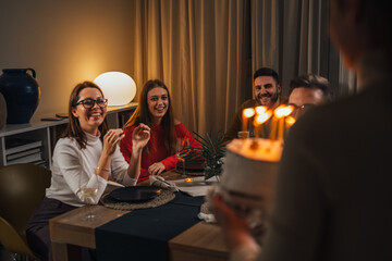 Wall Mural - Birthday girl brings cake to her friends