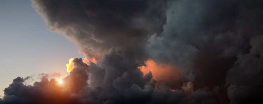 Fototapete - Panorama of dark clouds at sunset time
