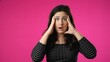 © Robert Peak - Portrait of pretty brunette young woman 20s 30s years old posing isolated on pink background studio. Cover mouth with hands on face say wow omg no way