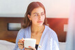 © cesar - young caucasian teenager woman at home relaxed and thoughtful holding mug