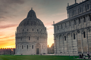 Wall Mural - Pisa, Italy, 14 April 2022:  View of Pisa Baptistery at sunset