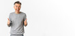 © Mix and Match Studio - Image of amazed and happy middle-aged man, showing thumbs-up and smiling, standing over white background