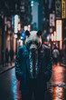 Panda bear in a suit stands in a city