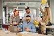 © dsheremeta - Surprise. Mixed race happy people celebrating a birthday of colleague in the modern office.