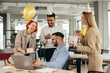 © dsheremeta - Surprise. Mixed race happy people celebrating a birthday of colleague in the modern office.