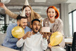 © dsheremeta - Business team celebrating a birthday of collegue in the modern office.