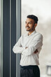 © dsheremeta - Young Hindu businessman posing near the window in the office.