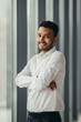 © dsheremeta - Young Hindu businessman posing near the window in the office.