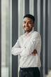 © dsheremeta - Young Hindu businessman posing near the window in the office.