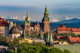 Fototapeta Desenie - Wawel castle during colorful sunset with snowy Tatra mountains in the background, Krakow, Poland