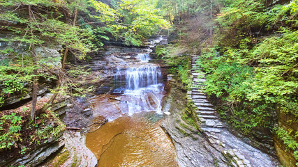 Wall Mural - View over gorge with staircase and waterfall