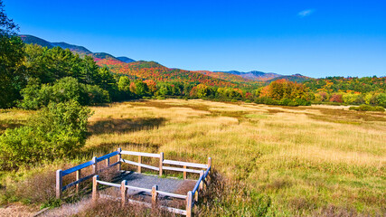 Wall Mural - View stunning fields and colorful mountains from small fenced platform