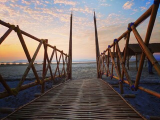 Wall Mural - Pier at sunset. Location - Panikhaiti picnic spot, Assam, India. 