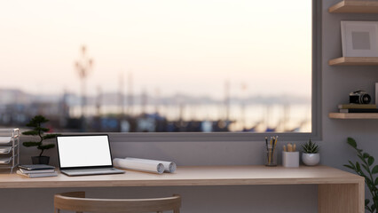 Wall Mural - architect and engineer office desk with laptop, blueprints and office supplies on table against wind