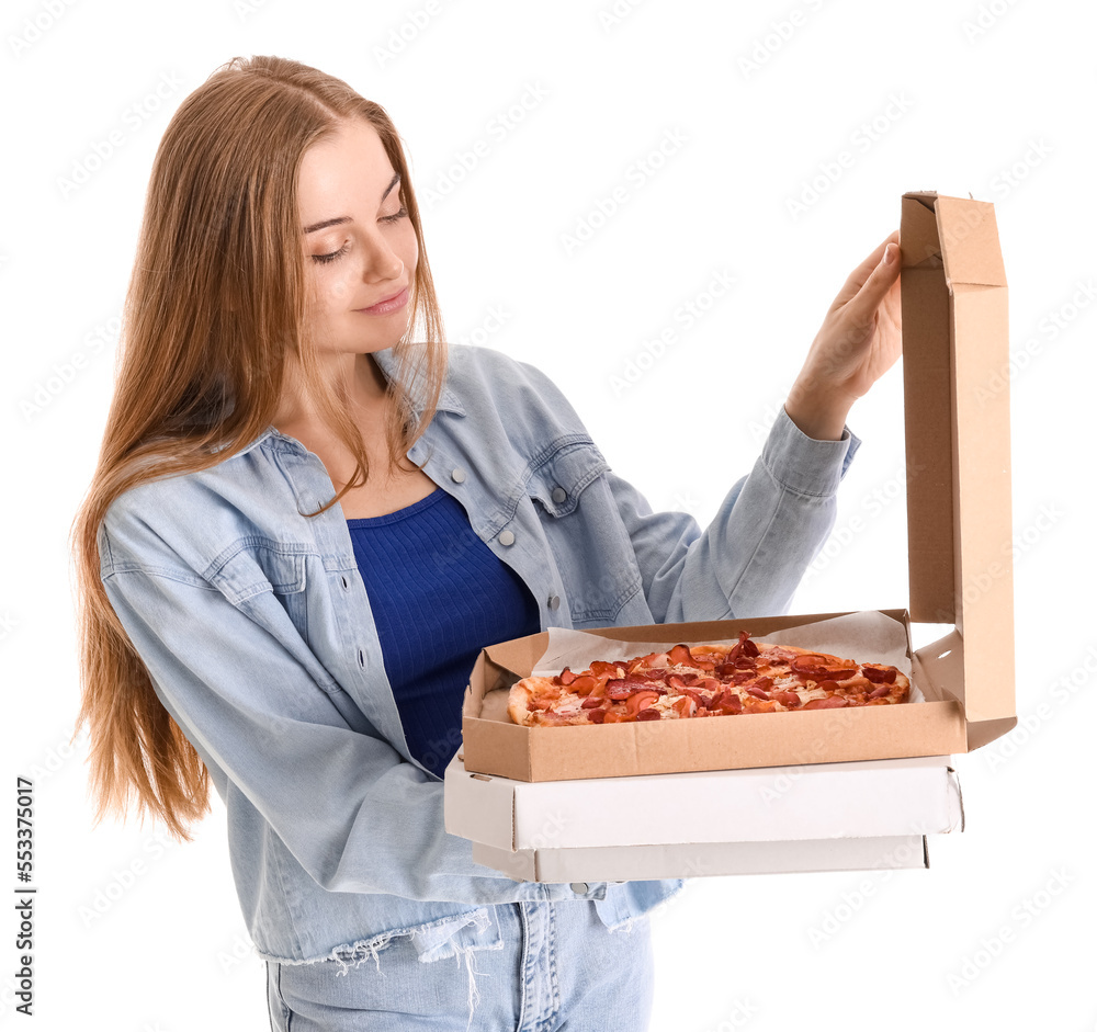 Beautiful young woman holding boxes with fresh pizza on white background