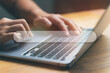 © Twenty-nine - Close up hand using laptop with search bar icon. Online research, search engine concept.