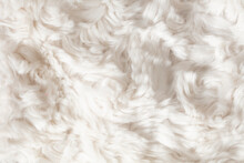 Background of white faux fur closeup.