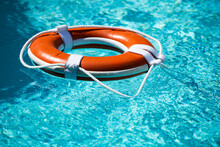 Safety Equipment, Life Buoy Or Rescue Buoy Floating On Sea To Rescue. Help In Water Concept.