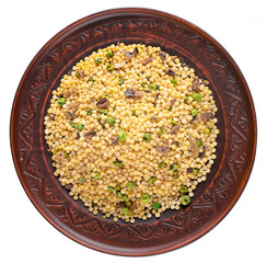 Wall Mural - Pearl couscous with peas and dry mushrooms on a brown plate