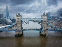Aerial View Of The Tower Bridge In London, England, With Snow And Ice During Winter Time