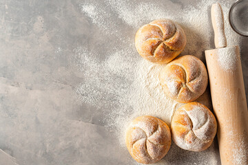 Aufkleber - Mini bun bread on a white background with rolling pin top view copy space. Home baking concept