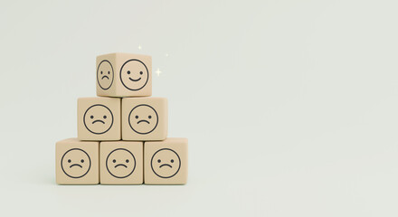 Wall Mural - world mental health day concept or feedback rating and positive customer review, wood cube stacking with emotion face icon on blue background	