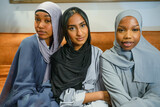 Fototapeta Londyn - Portrait of three Muslim women at home