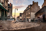 Fototapeta Uliczki - Central street in Blois, France. Beautiful city with mist,
