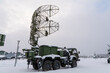mobile air defense truck with radar antenna. Satellite dishes or radio antennas sky.
