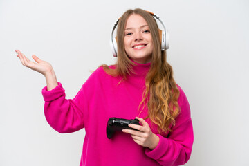 Sticker - Young pretty woman playing with a video game controller isolated on white background extending hands to the side for inviting to come