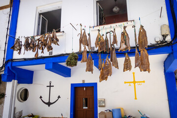 Wall Mural - Traditional dried fish in front of a Cudillero house, Asturias, Spain