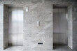 © Jirawatfoto - modern metal elevators in hotel lobby