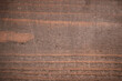 Old wooden background with rust-like cracks. Board, texture, rough, brown, scratch, background for pictures, rust