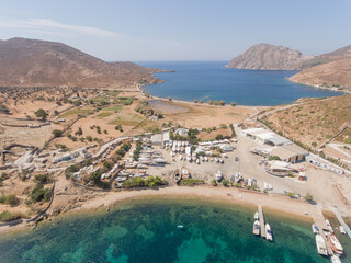 Wall Mural - Aerial view of harbor full of sailing and fishermen boats at idyllic coast of Greece