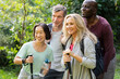© PhotoAlto - Group of diverse senior friends taking a break in their hike to pose for a photo