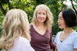 © PhotoAlto - Small group of senior ladies chatting outdoors