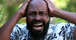 African man reacting with SHOCK and TERROR. Surprised emotion, unbelief