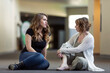 © Designpics - A young woman and her youth leader discussing their faith in a hallway of a church: Edmonton, Alberta, Canada