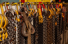 Chains With Hooks And Hanging On The Wall For Use In A Metal Fabrication Plant; Innisfail, Alberta, Canada