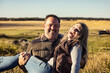 © Designpics - Portrait of a mature couple having fun on their farm; Alcomdale, Alberta, Canada