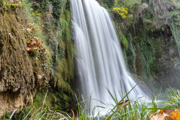 Wall Mural - Beautiful and big waterfall of water falling in the Monasterio de Piedra in the middle of November in. Zaragoza, Spain