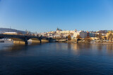 Fototapeta Paryż - Snowy Prague Lesser Town with Prague Castle above River Vltava in the sunny Day , Czech republic