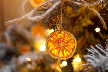 The Christmas tree is decorated with dried oranges.