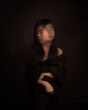 © Milou Dirks - abstract double exposure portrait of asian girl in black in dark studio style