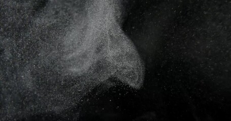 Wall Mural - Particles of Dust, Flour, Debris, Flying on Black Background. RED camera footage in slow motion. High quality 4k footage